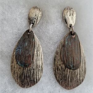 Fashion Jewelry silver and bronze tone post earrings.